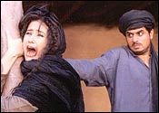 Manisha Koirala [left] in Escape From Taliban