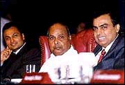 Mukesh (right) with his late father Dhirubhai Ambani (centre) and younger brother Anil.