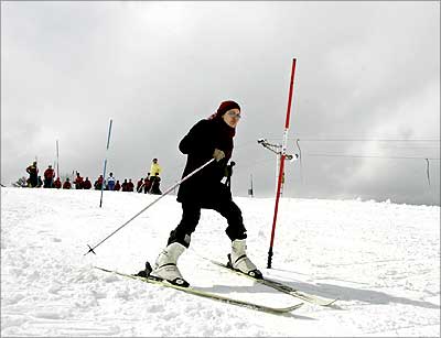 A woman learns to ski on a slope in Gulmarg, 55 km (34 miles) west of Srinagar