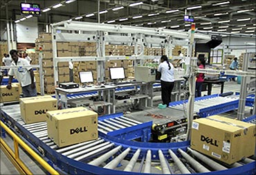 Computers packed into boxes are transported on a conveyor belt at a Dell factory in Sriperumbudur.