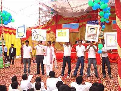 Promoters explaining branchless banking to villagers.