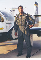Capt Ravi Inder Chaudhary in flight suit next to the T-37 Tweet primary trainer