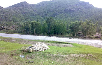 A grave on the banks of River Swat