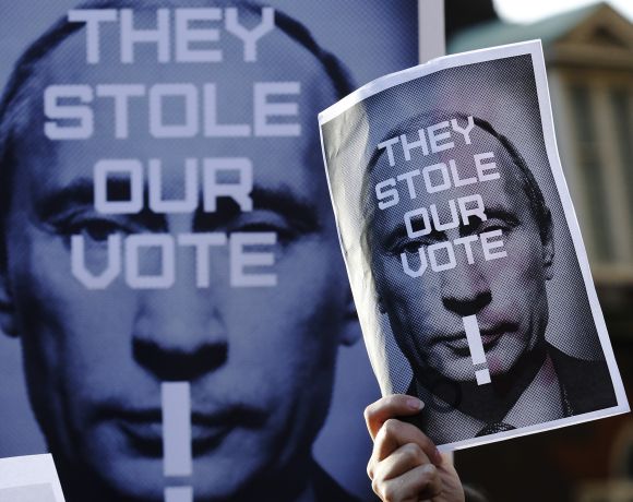Russian residents in Britain protest against Putin outside the Houses of Parliament in London