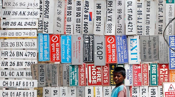 A stall sells license plates and other signs at an automobile market in Gurgaon near New Delhi