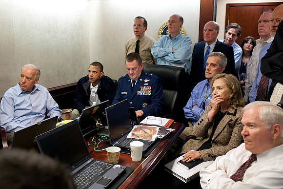 US President Barack Obama and Vice President Joe Biden (left), along with members of the national security team, receive an update on the mission against Osama bin Laden in the Situation Room of the White House in this May 1, 2011 photograph