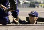 Aussie cop inspecting a drain