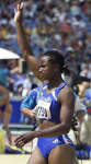Eunice Barber waves to the crowd after completing a high jump in the heptathlon. REUTERS/Jerry Lampen 