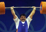 Iranian weightlifter Hossein Rezazadeh lifts 260 kg in the clean and jerk. REUTERS/Oleg Popov 