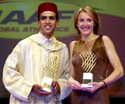British runner Paula Radcliffe (R) smiles as she poses with Morocco's runner Hicham El Guerrouj (L) after they received the Female and Male Athletes of the Year Awards