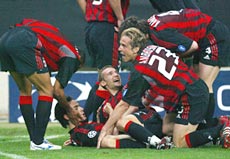 A.C. Milan players celebrate after  Inzaghi scores 