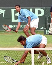 Paes and Bhupathi in action during the doubles