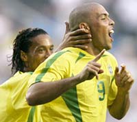 Ronaldo (R) celebrates his goal with team mate Ronaldinho.