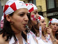 Female Croatian soccer fans celebrate in Zagreb the 2-1 victory over Italy 