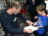 Zinedine Zidane signs autographs on return from the World Cup.