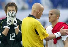 Referee Pierluigi Collina (C) consoles Japan's Shinji Ono (R) as goalkeeper Seigo Narazaki (L) covers his face after the 1-0 loss to Turkey. 