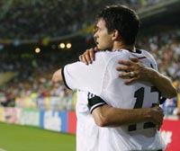 Michael Ballack (R) is hugged by team mate Torsten Frings after scoring.
