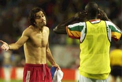 Amdy Faye of Senegal with Bulent Korkmaz of Turkey after the match.