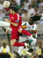 Turkey's captain Hakan Sukur (L) and Senegal's Ferdinand Coly 