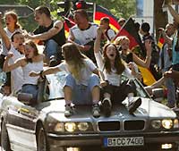 German soccer fans celebrate in Berlin after Germany won against South Korea 