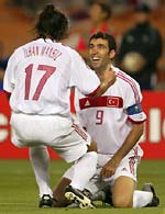 Ilhan Mansiz (L) is congratulated by teammate Hakan Sukur after scoring Turkey's second goal against South Korea.