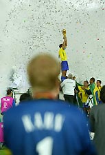 Kahn watches as Cafu raises the World Cup trophy.