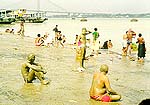 Bathers smear themselves with mud at Babu ghat