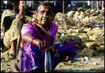 A fisherwoman proudly display her wares