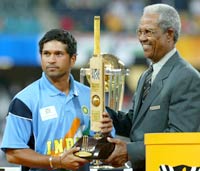 Tendulkar receives his prize from Sobers