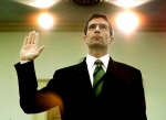 Michael Kopper swears-in before a US House of Representatives subcommittee. Photo: Reuters/Larry Downing