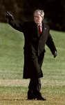 US President George W. Bush walks on the south lawn of the White House