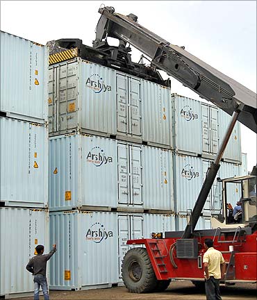 A container is lifted to load onto a truck at Thar Dry Port in Sanand.