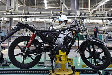 An employee works at an assembly line of Twister motorcycle.
