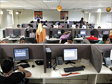 Employees work at a call centre near Srinagar.