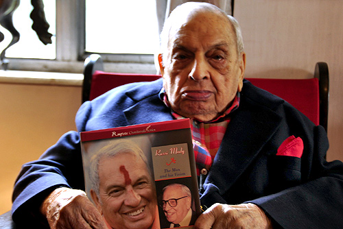 Russi Mody poses with a book on him.
