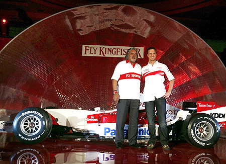 Vijay Mallya , Chairman and Chief Executive Officer of Kingfisher Airlines Ltd and Toyota's Formula One driver Ralf Schumacher of Germany pose for photographers.