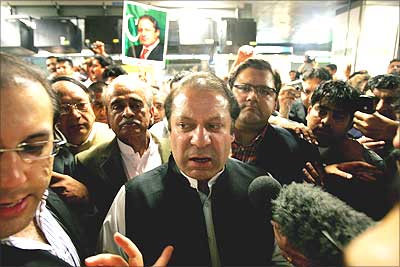 Nawaz Sharif speaks to the media inside Heathrow airport in London, before he boarded a flight to Islamabad.