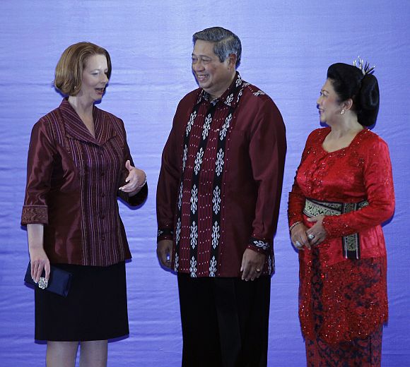 Australian Prime Minister Julia Gillard is greeted by Indonesian president