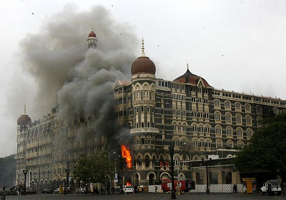 Hotel Taj Mahal is engulfed in smoke during the 26/11 terror attacks in Mumbai