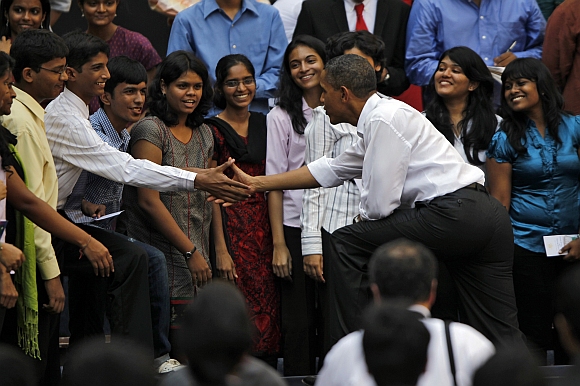Obama greets students at a town hall meeting at St Xavier's college in Mumbai in this November 7, 2010 photograph