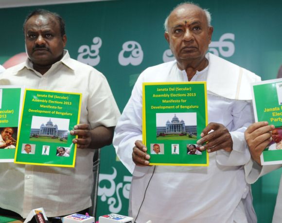 JD-S leaders H D Deve Gowda and H D Kumaraswamy unveiling the party manifesto in Bangalore