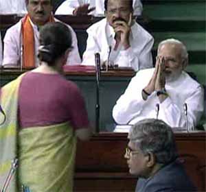 Prime Minister Narendra Modi greets Congress President Sonia Gandhi in Parliament.