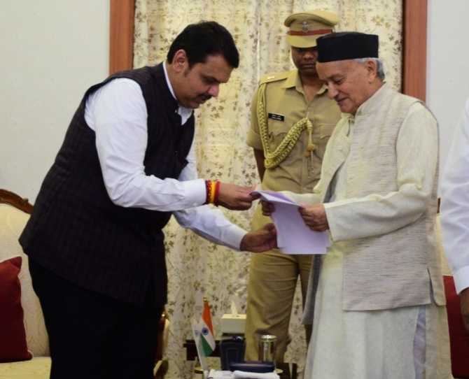 Devendra Fadnavis submits his resignation as Maharashtra chief minister to Governor Bhagat Singh Koshyari, November 26, 2019. Photograph: Arun Patil