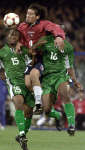 Ivan Zamorano (C) goes head and shoulders above Godwin Okpara (L) and Isaac Okoronkwo (R) of Nigeria during their match. REUTERS 