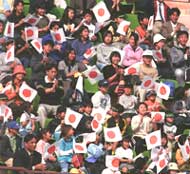 Japanese fans cheer their team