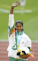 Anju George on the victory stand at the Asian Games
