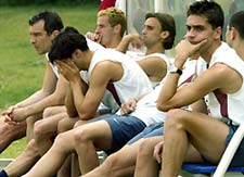 Portugal's soccer players (L-R) Jorge Costa, Sergio Conceicao, Armando Petit, Joao Pinto and Beto Severo sit as they wait to start training