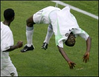 Julius Aghahowa does a series of back flips after putting Nigeria ahead.