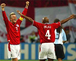 Beckham and Trevor Sinclair celebrate