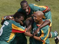 Senegal players celebrate making the second round.